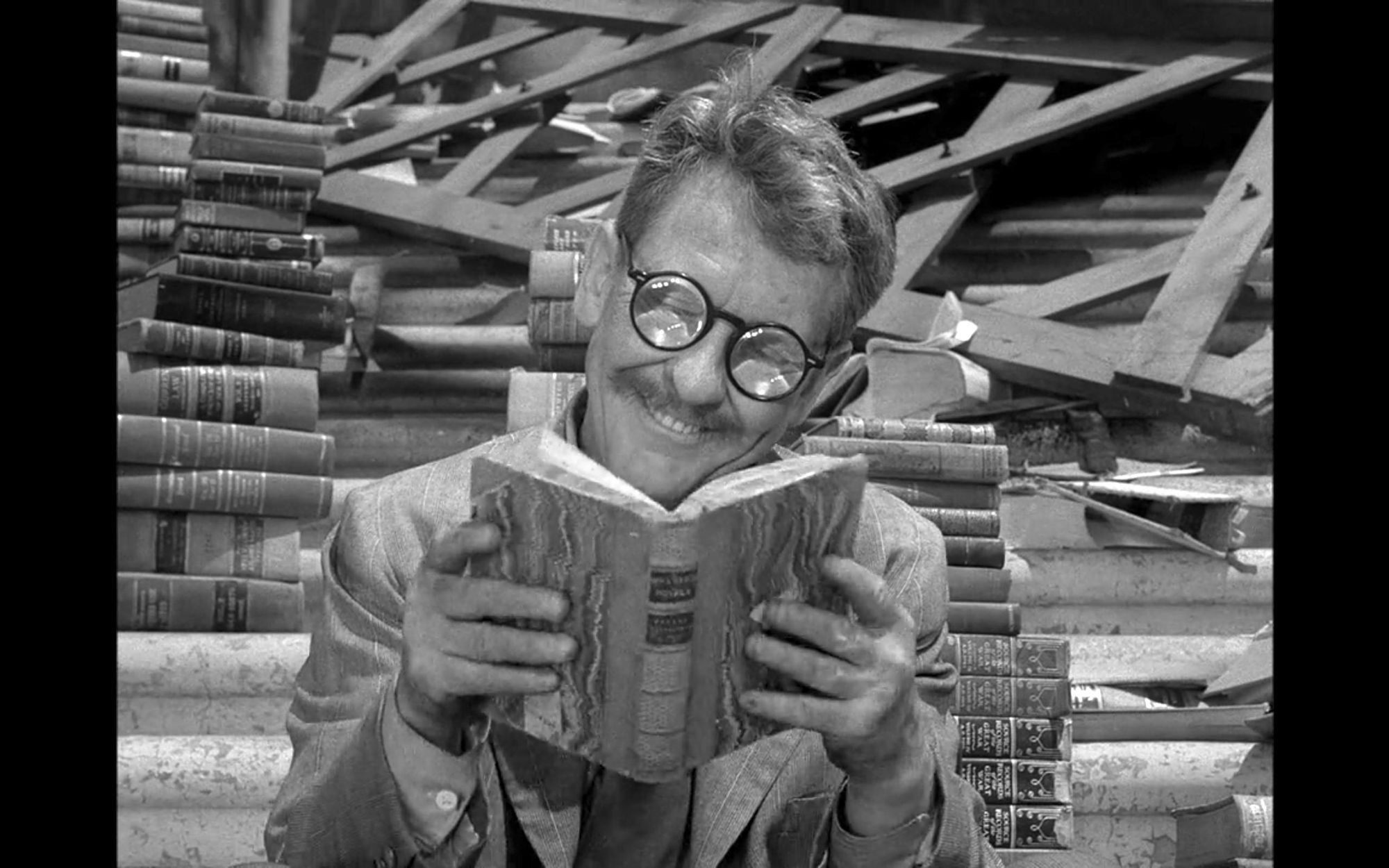 Image of Burgess Meredith reading from Time Enough at Last episode of Twilight Zone
