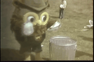 Image of Woodsy the Owl throwing out trash