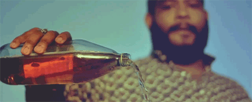 GIF of someone pouring our some liquor in honor of the dead