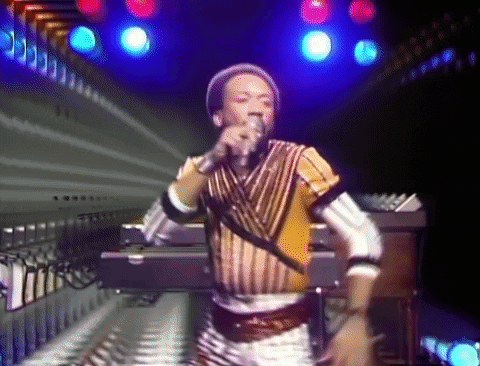 GIF of Earth Wind and Fire music video wherein they are dancing to "September"